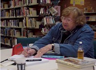 Rae McGreevy writing in the Highfields Library during the project.